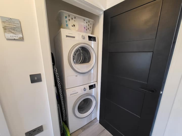 Stacked washer and dryer unit