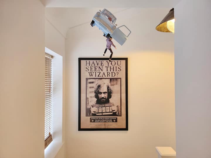 Toy car above wizard poster