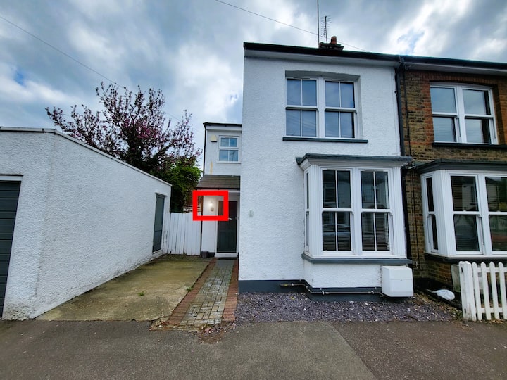 House entrance with cloudy sky