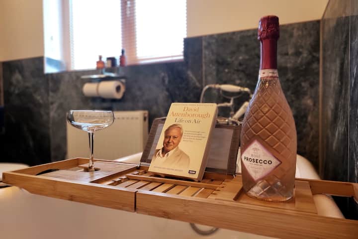 Prosecco, book, and glass