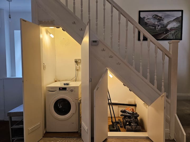 Washing machine under staircase storage