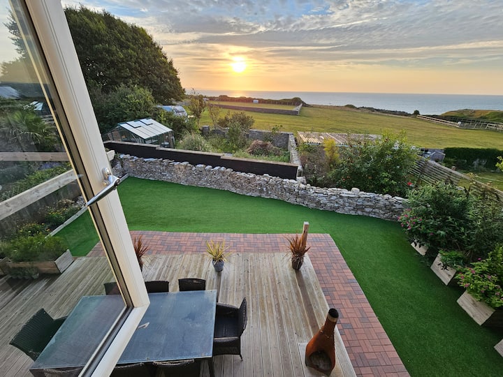 Sunset over coastal garden